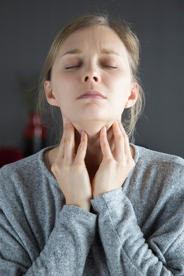 sick woman with closed eyes having sore throat touching neck_1262 18657